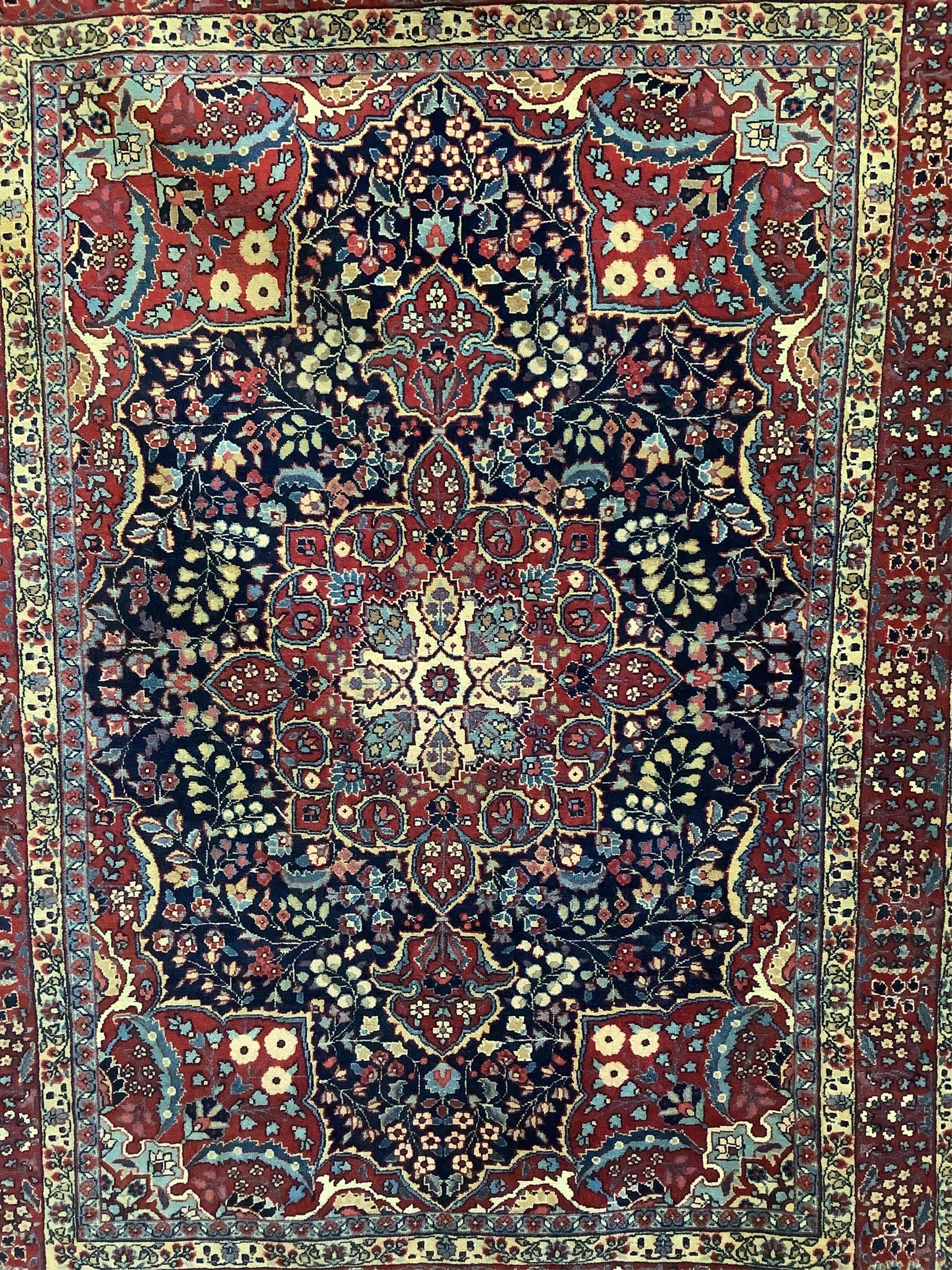 A Sarouk Feraghan Persian blue ground rug, 186 x 137cm. Condition - good